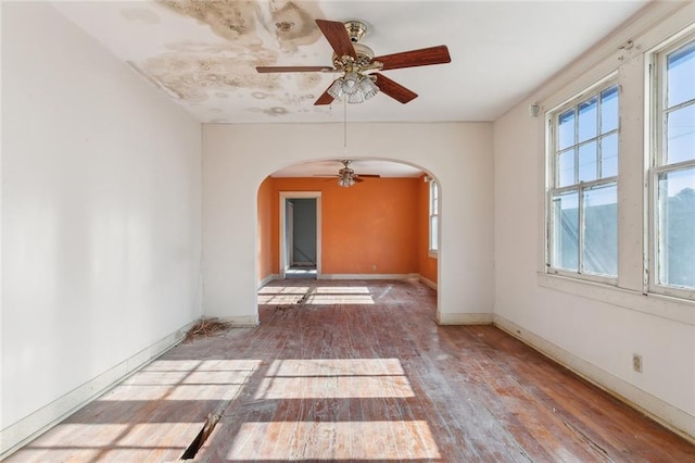 spare room with hardwood / wood-style flooring and ceiling fan