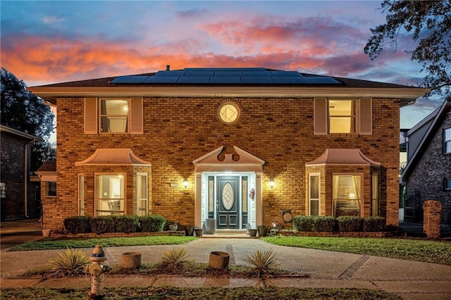 view of front of home with solar panels