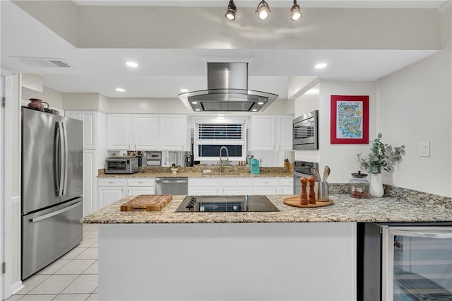 kitchen featuring white cabinets, sink, wine cooler, island range hood, and stainless steel appliances