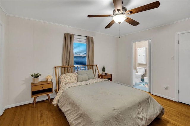 bedroom with wood-type flooring, ensuite bathroom, ceiling fan, and ornamental molding