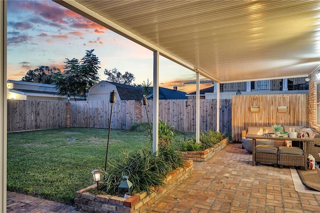 patio terrace at dusk with an outdoor hangout area