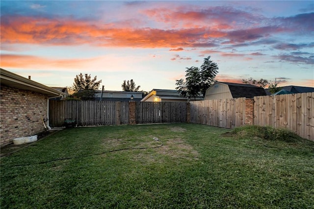 view of yard at dusk