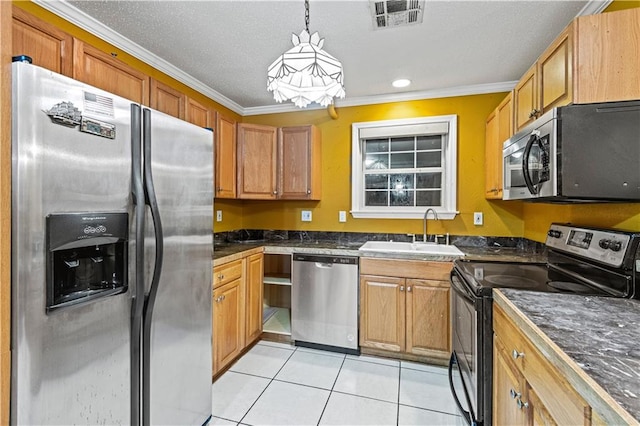 kitchen with pendant lighting, stainless steel appliances, ornamental molding, and sink