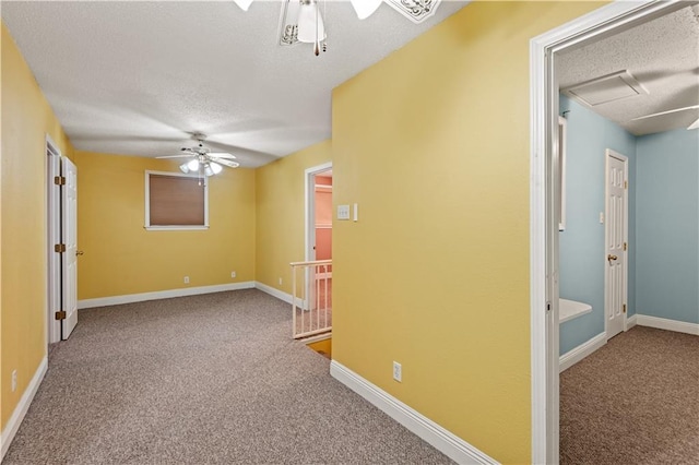 unfurnished room featuring carpet, a textured ceiling, and ceiling fan