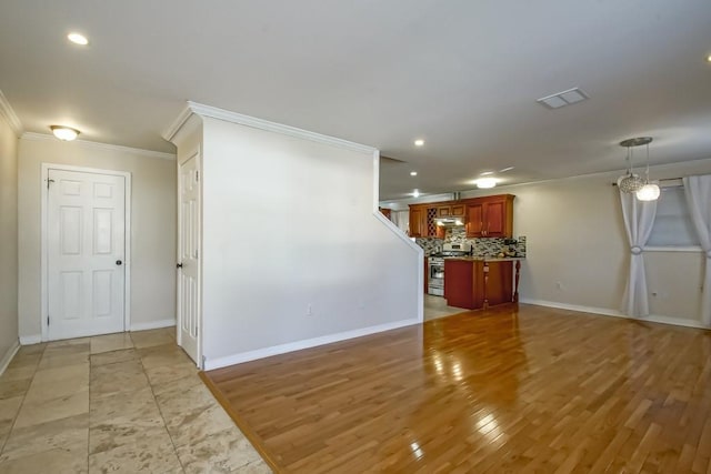 unfurnished living room featuring light wood-type flooring and ornamental molding