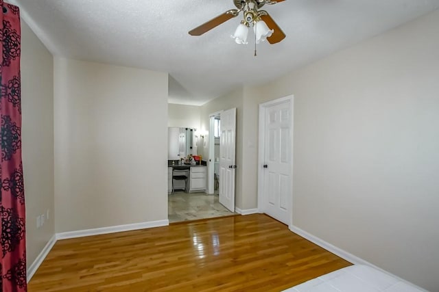 unfurnished room featuring ceiling fan and wood-type flooring