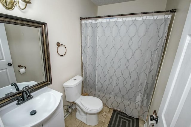 bathroom with tile patterned flooring, a shower with curtain, vanity, and toilet