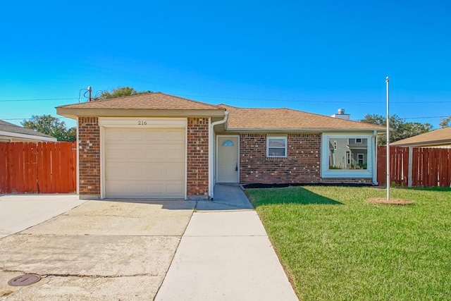 ranch-style home with a front yard and a garage