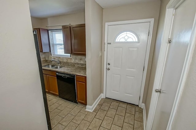 kitchen featuring dishwasher, a wealth of natural light, and sink