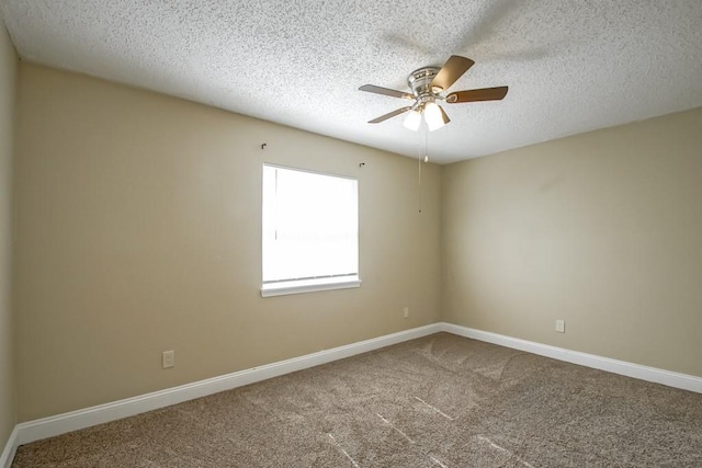 unfurnished room featuring ceiling fan, carpet, and a textured ceiling