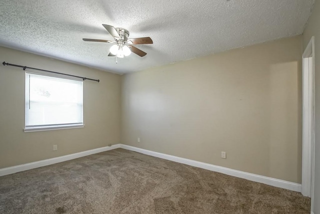 spare room with carpet, ceiling fan, and a textured ceiling