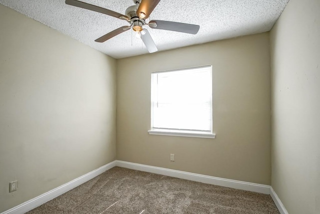 unfurnished room featuring ceiling fan, carpet, and a textured ceiling