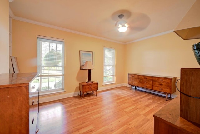 sitting room with ceiling fan, light wood-type flooring, and ornamental molding