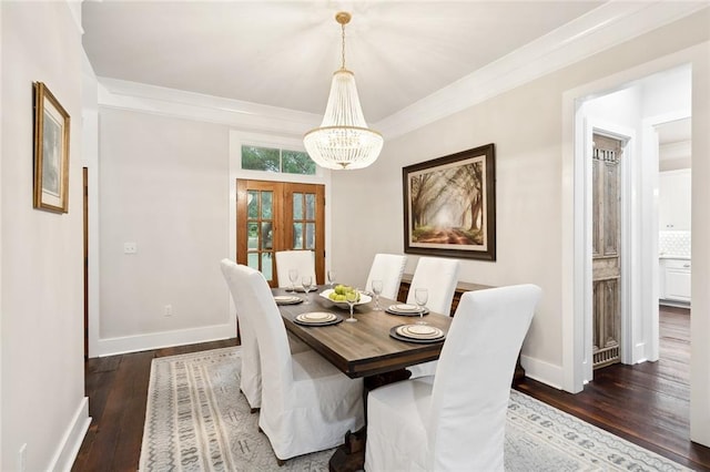 dining space featuring a chandelier, dark hardwood / wood-style floors, and ornamental molding