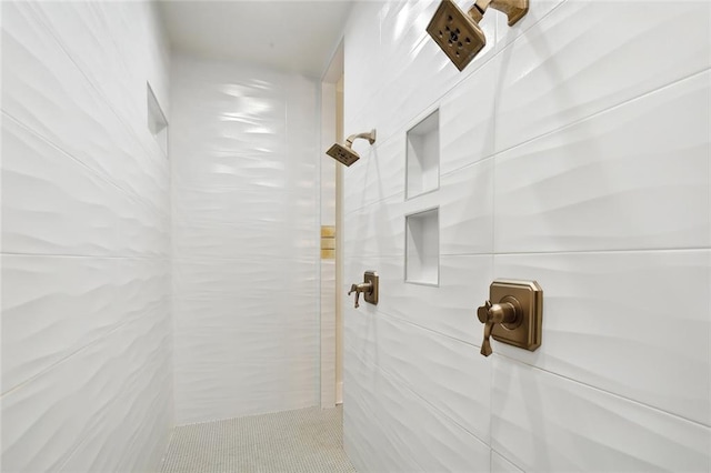 bathroom with a tile shower