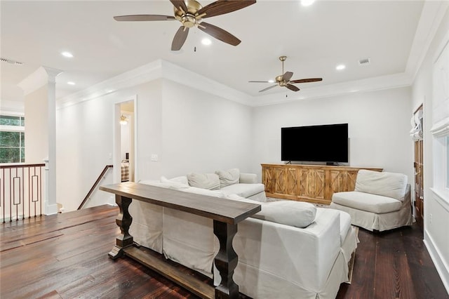 living room with dark hardwood / wood-style floors, ceiling fan, and crown molding