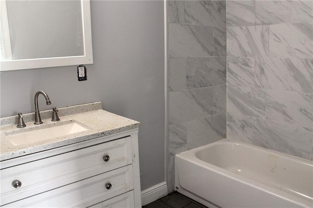 bathroom with vanity and tiled shower / bath combo