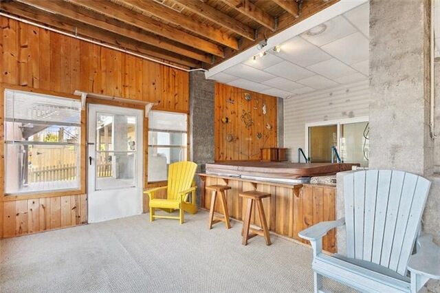 180 Lakeview Dr Unit A, Slidell, LA 70458 - living area with wooden walls and carpet floors