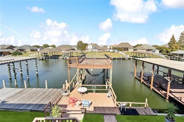 180 Lakeview Dr Unit A, Slidell, LA 70458 - dock area with a water view, a residential view, and a lawn