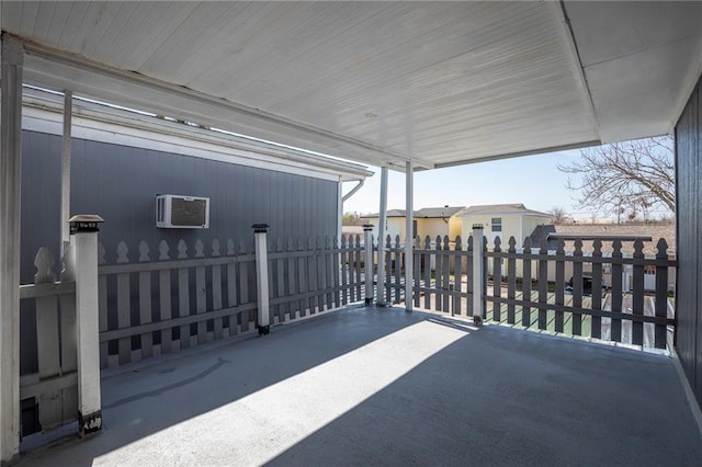 view of patio / terrace featuring a wall mounted air conditioner