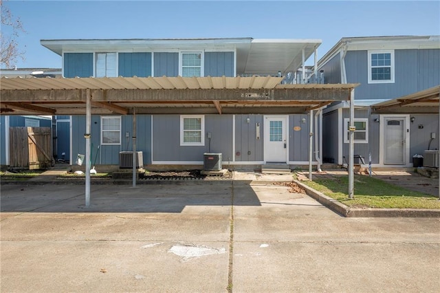 view of front of house featuring covered parking and central AC unit