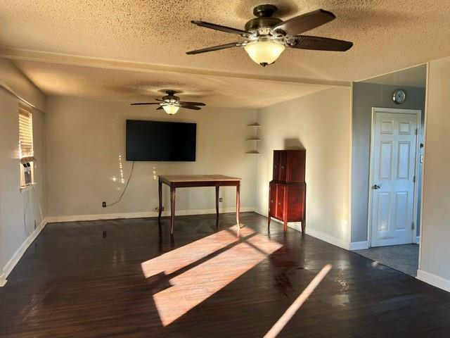 interior space featuring dark hardwood / wood-style flooring and a textured ceiling