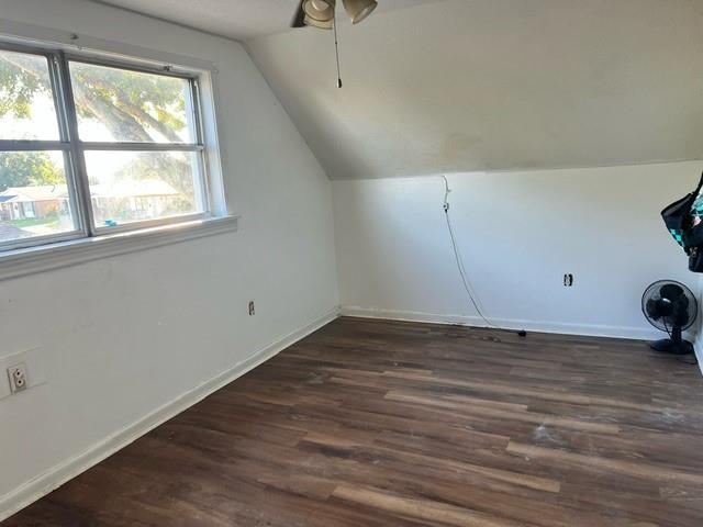 bonus room featuring ceiling fan, dark hardwood / wood-style flooring, and vaulted ceiling