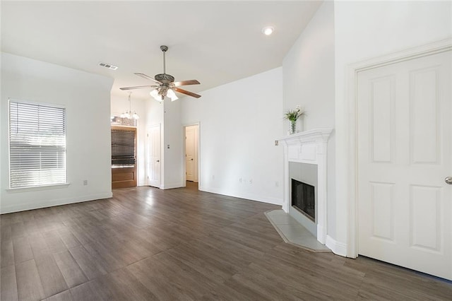 unfurnished living room featuring dark hardwood / wood-style flooring and ceiling fan