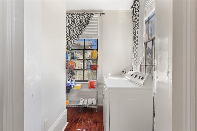 washroom featuring dark hardwood / wood-style floors and washer and dryer