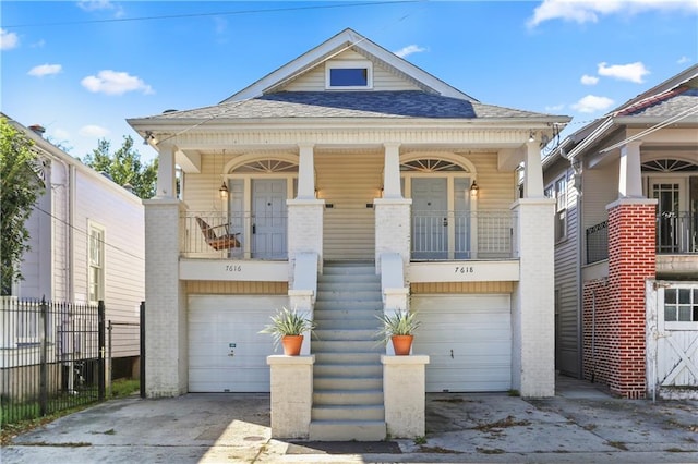 7616-18 Hampson St, New Orleans, LA 70118 - view of front of property with a garage