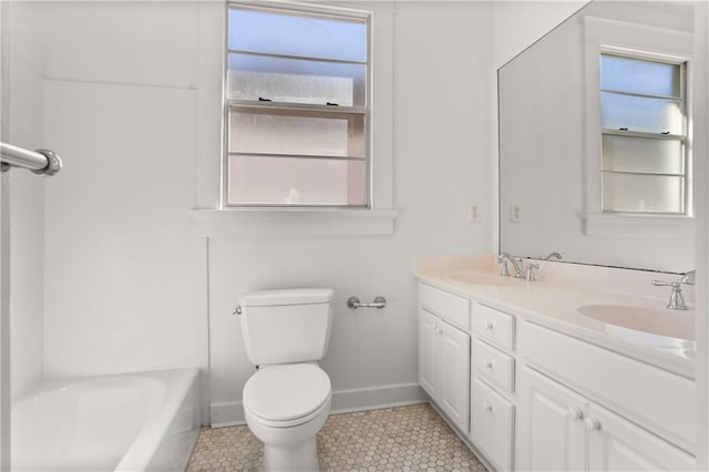 full bathroom with washtub / shower combination, tile patterned floors, vanity, and toilet