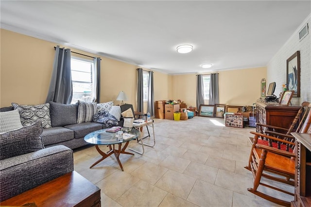 tiled living room with ornamental molding