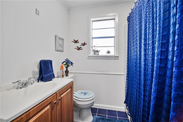 bathroom featuring vanity, tile patterned floors, toilet, ornamental molding, and walk in shower