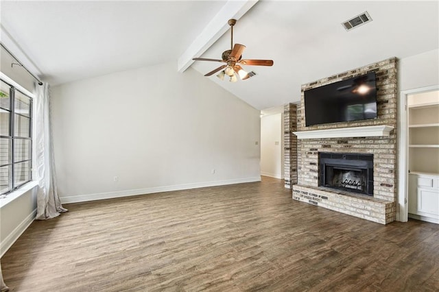 unfurnished living room with lofted ceiling with beams, a brick fireplace, ceiling fan, and hardwood / wood-style flooring