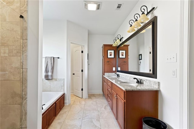 bathroom featuring vanity and a bathtub