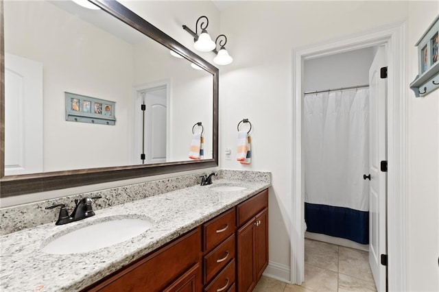 bathroom with tile patterned flooring and vanity