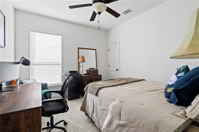 bedroom featuring light carpet and ceiling fan