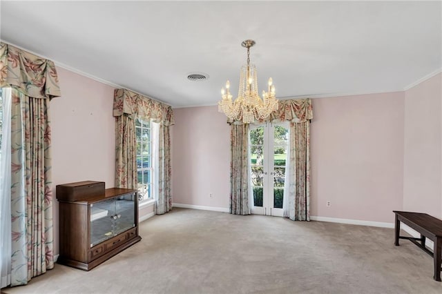 interior space with crown molding and an inviting chandelier