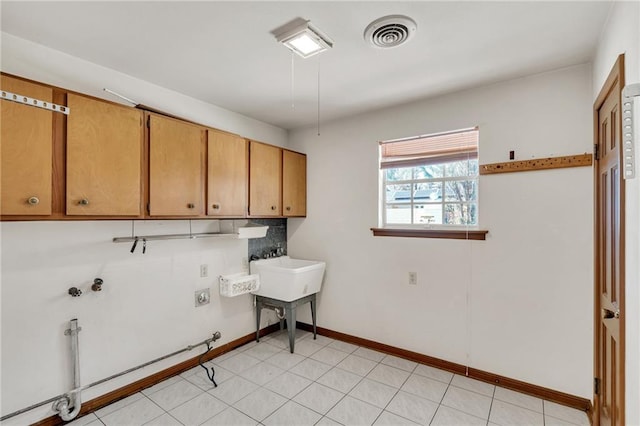 washroom with electric dryer hookup, cabinets, washer hookup, and gas dryer hookup