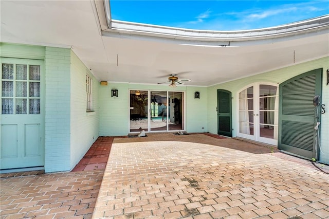 view of patio featuring french doors and ceiling fan