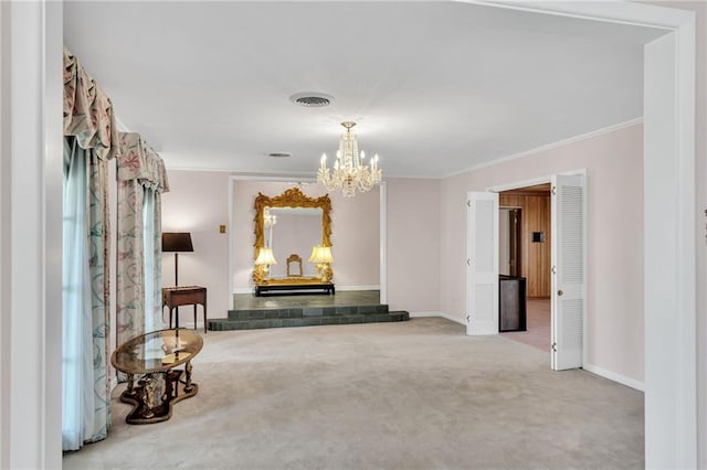 hall with carpet floors, crown molding, and an inviting chandelier