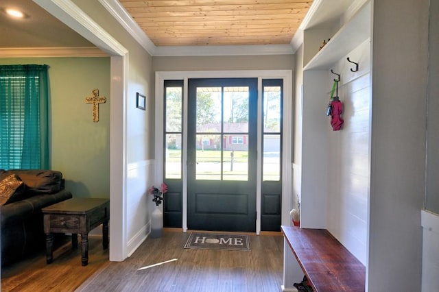 doorway to outside featuring hardwood / wood-style floors, crown molding, and wood ceiling