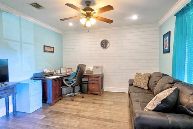 office space with light hardwood / wood-style flooring, ceiling fan, and crown molding