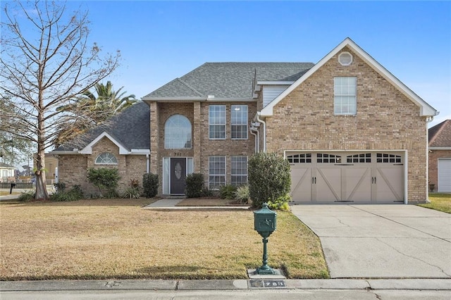 view of property with a front yard and a garage