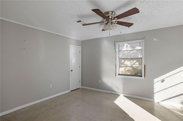 spare room featuring a textured ceiling, ceiling fan, and ornamental molding