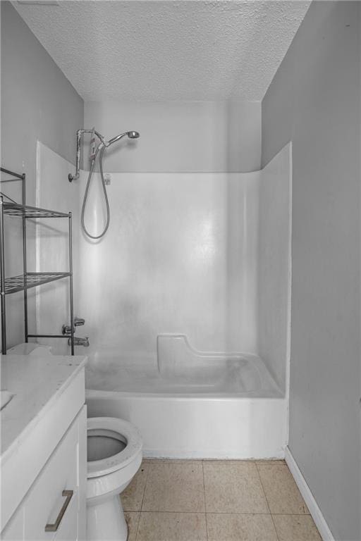 full bathroom featuring vanity, bathtub / shower combination, tile patterned flooring, toilet, and a textured ceiling