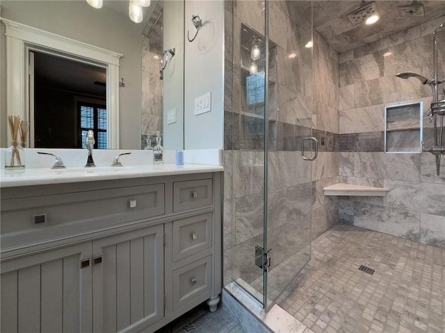 bathroom with vanity and an enclosed shower