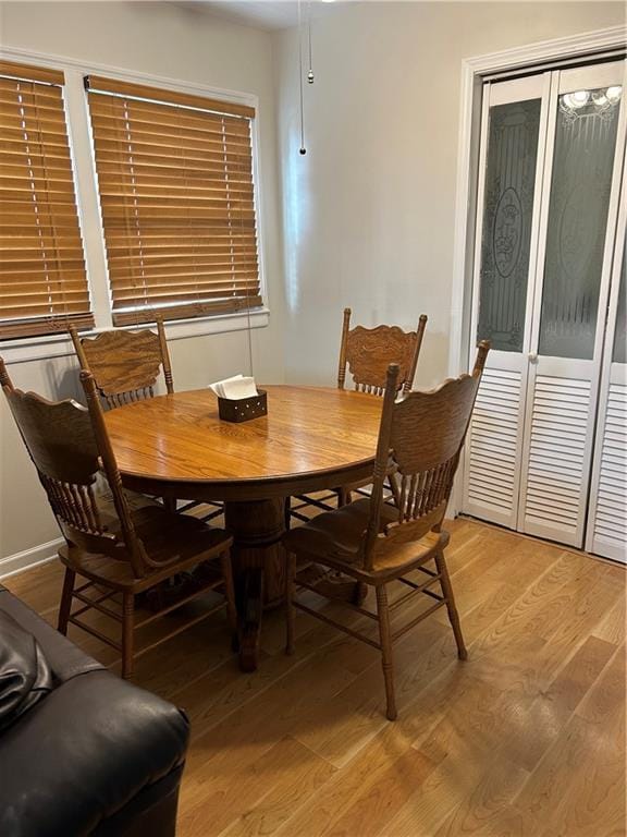 dining space featuring light wood-type flooring