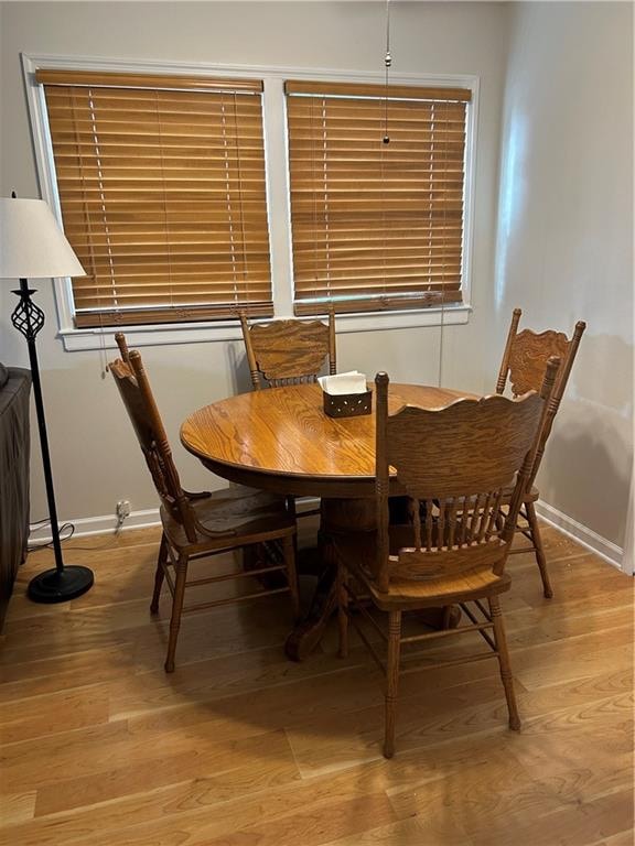 dining room with light wood-type flooring