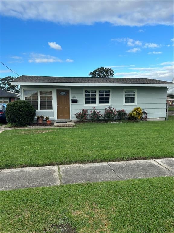 ranch-style house with a front yard